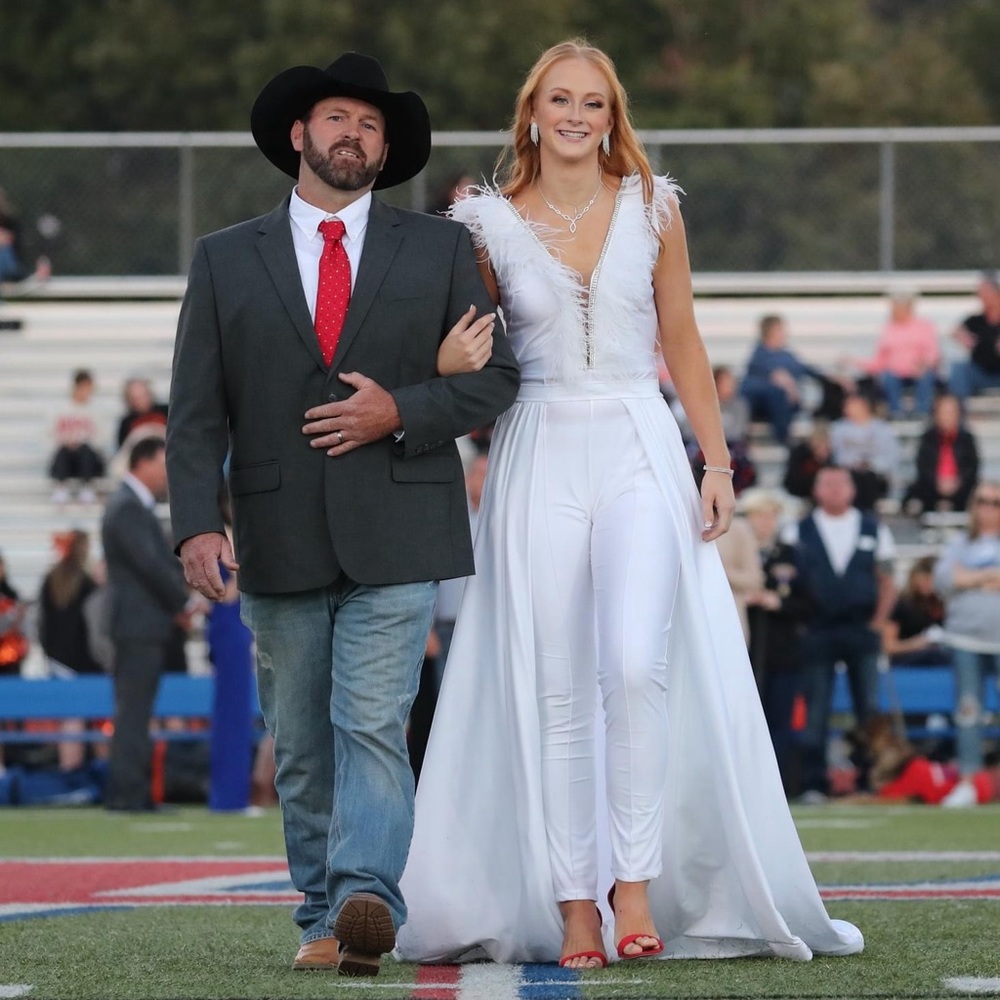 was told it’s  Jovani, the place we bought it cut tags out & put their own tag.